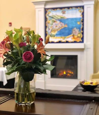 A decorative flower arrangement in a cozy common area