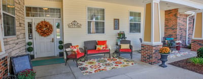 Welcoming exterior entry with seating and decor