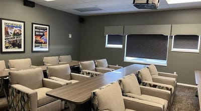 A well-lit common area with comfortable seating