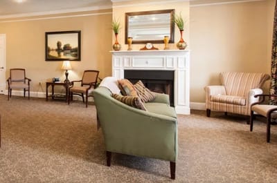 Common area with seating and fireplace