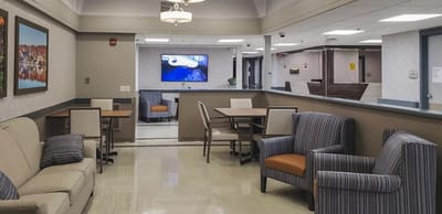 Interior common area with seating and TV