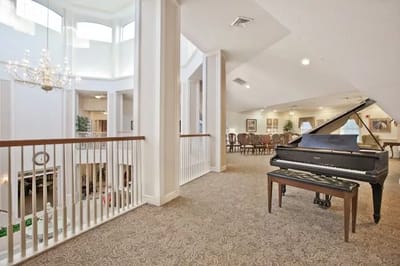 Interior view of a common area with a piano