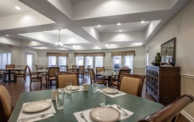 Bright dining room with tables set for meals