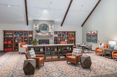 Comfortable common area with bookshelves and seating