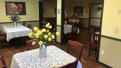 Dining area with tables and flowers