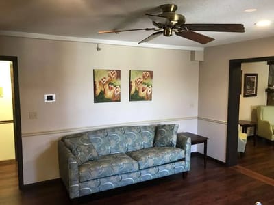 Cozy living room area with a couch and artwork