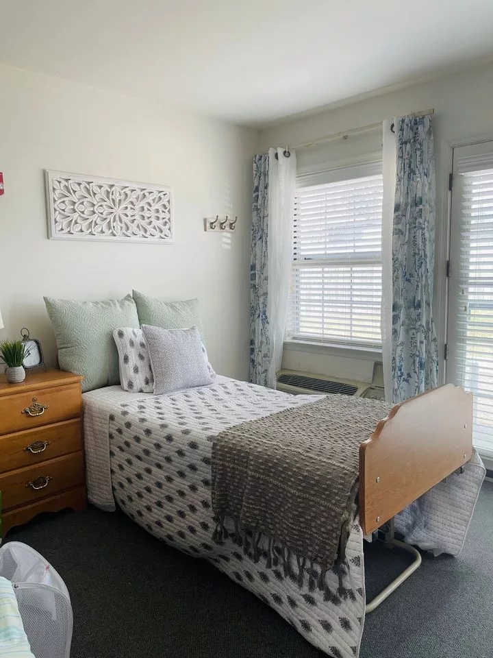 Cozy private resident room with a bed and decor