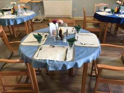 A dining room table set for a meal