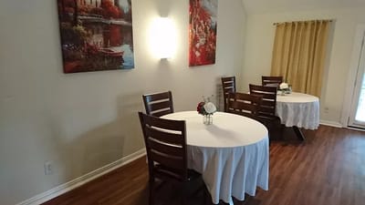 Dining area with tables set for residents