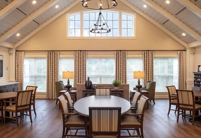 Bright common area with large windows and seating