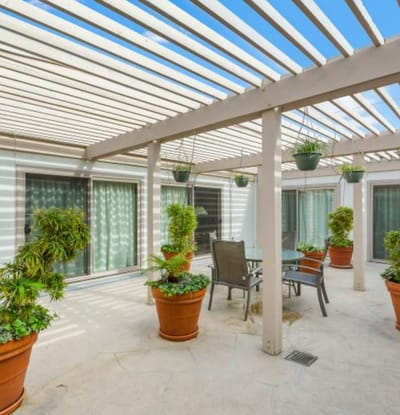 Outdoor patio area with seating and plants
