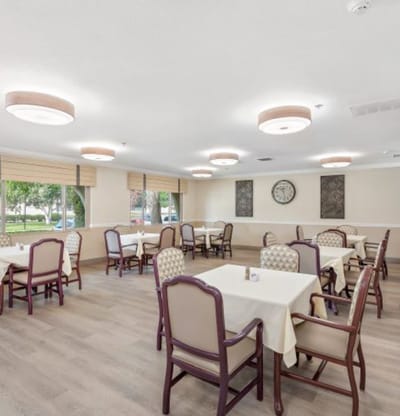 Bright dining area with tables and chairs