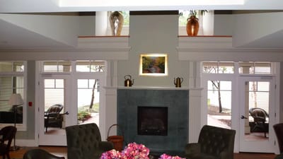Common area with seating near a fireplace