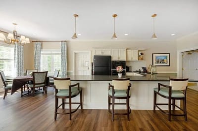 Bright interior common area with kitchen seating