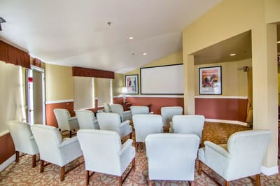 Bright activity room with chairs arranged for a gathering