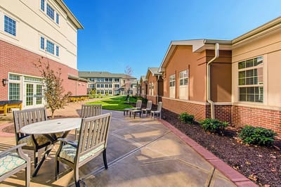 Sunny outdoor patio area with seating and tables