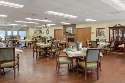 Dining area with tables and chairs set for meals