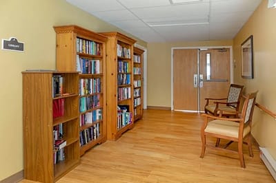 Interior view of a facility library with bookshelves