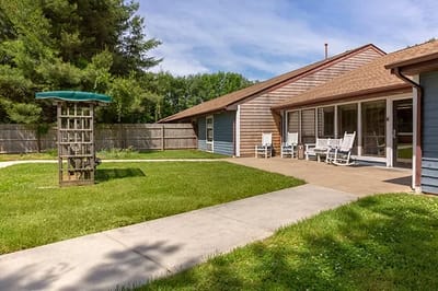 Outdoor garden area with seating and trees