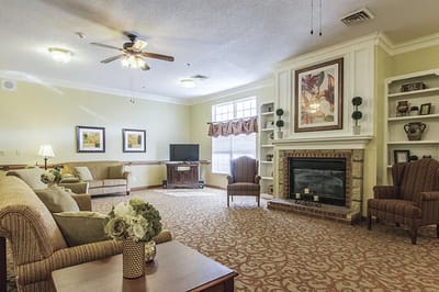 Cozy interior common area with seating and fireplace