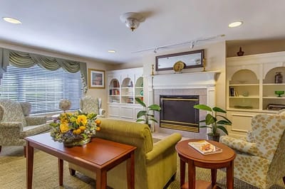 Cozy common area with seating and a fireplace