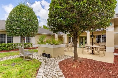 Outdoor seating area with tables and chairs