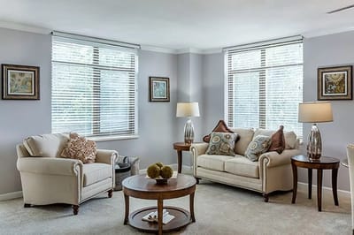 Bright common area with comfortable seating and artwork