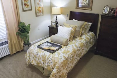 Cozy bedroom with floral bedding and decor