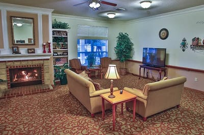 Cozy common area with seating and a fireplace