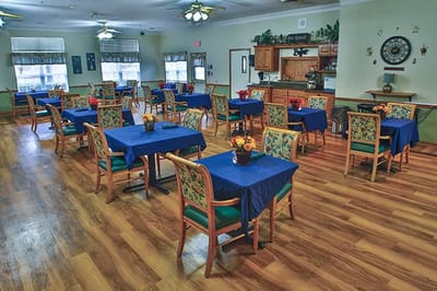 Bright dining room with tables set for meal service