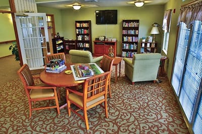 Cozy common area with bookshelves and seating