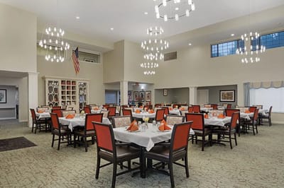 Bright and elegant dining area with tables set for meals