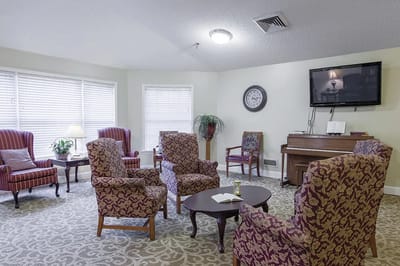 Cozy common area with seating and a piano