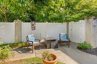 Cozy outdoor seating area with a fire pit and plants