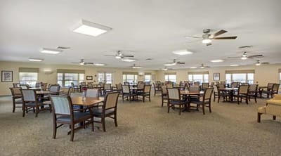 Bright dining area with tables and chairs
