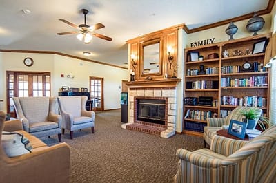 Cozy common area with seating and bookshelves