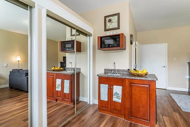 Interior view of a resident room with kitchenette