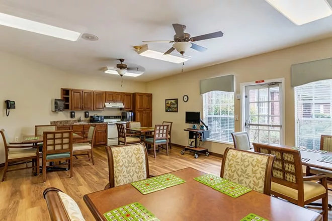 A bright common area with tables and chairs