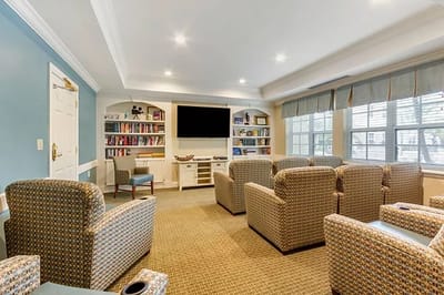 Bright common area with seating and bookshelves