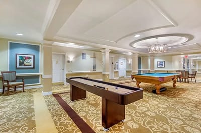 Interior activity room with pool tables and decor
