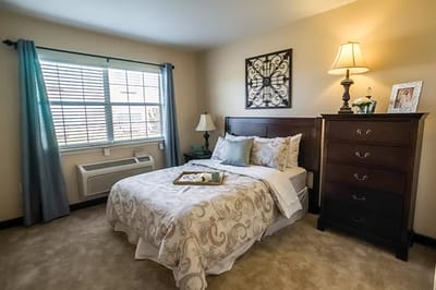 Cozy private bedroom with natural light and decor