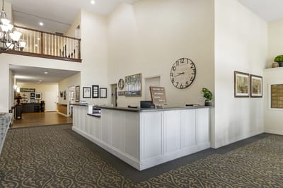 Bright lobby area with a reception desk
