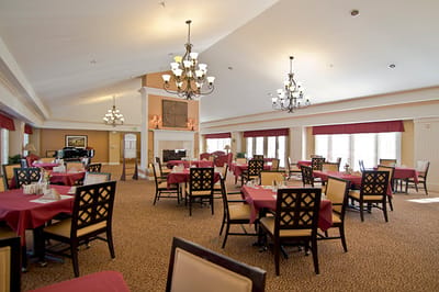 Dining area with tables set for residents