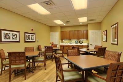 Bright interior common area with dining tables