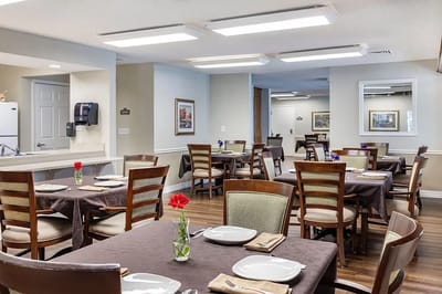 Dining room setup with floral centerpieces