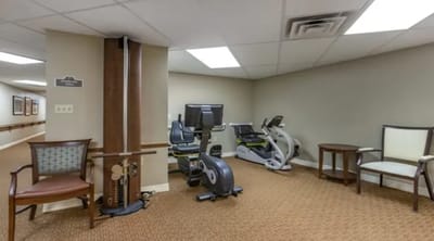 Fitness area with exercise equipment in a common room