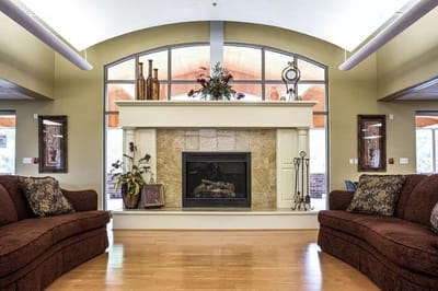 Cozy lobby area with a fireplace and seating