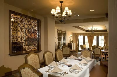 Elegant dining room setup with tables and chairs