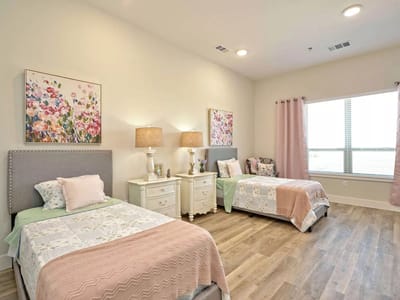 Well-decorated shared resident room with two beds