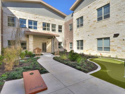 Outdoor courtyard with seating and putting green